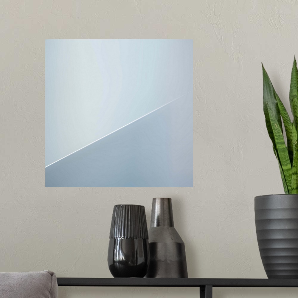 A modern room featuring Abstract image of architectural details, resembling a diagonal line.
