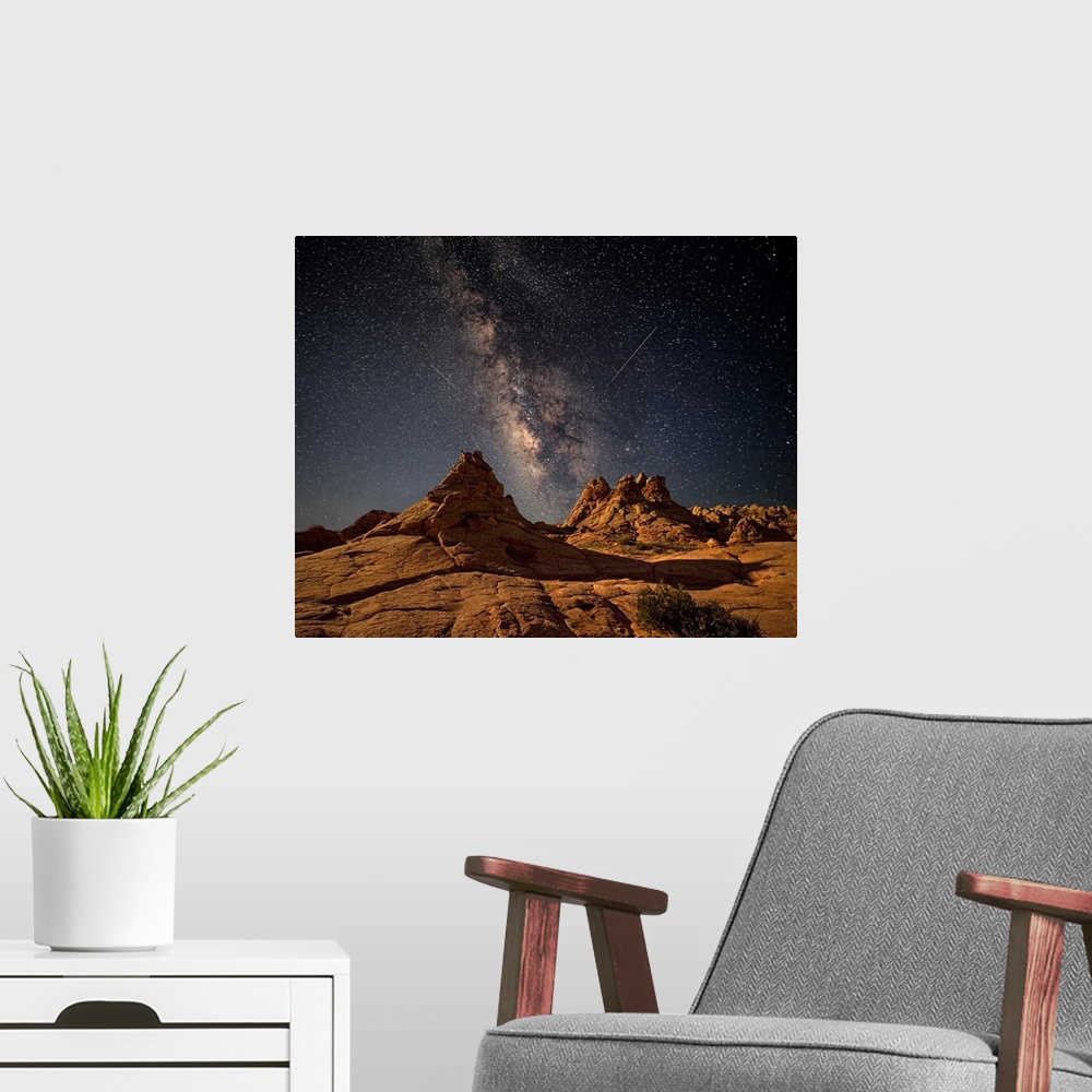 A modern room featuring Rock formations in the desert of Coyote Buttes, Arizona, under a starry night sky.