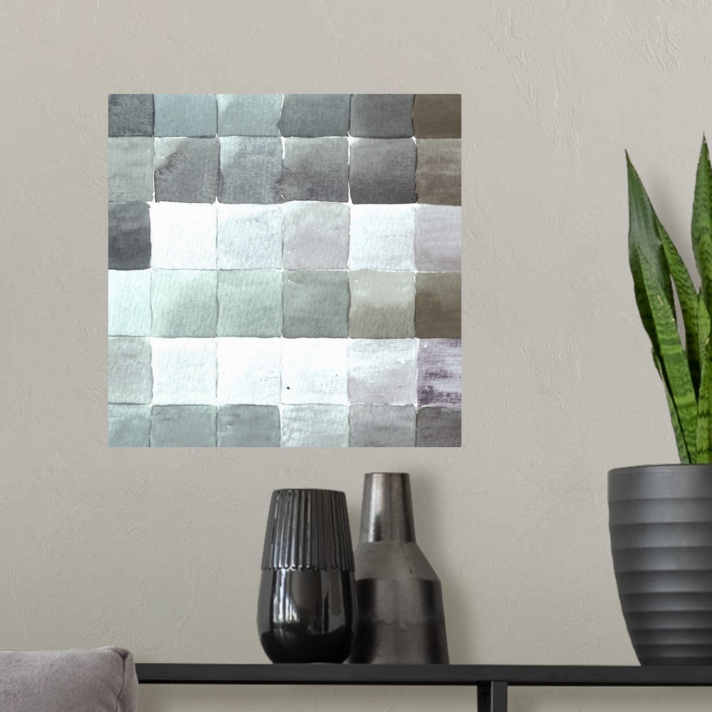 A modern room featuring Contemporary artwork of square tiles in various cool tones.