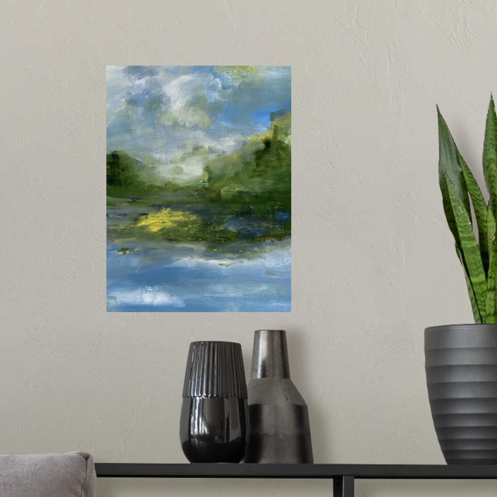 A modern room featuring Contemporary landscape painting of a lake with verdant hills and a cloudy sky.