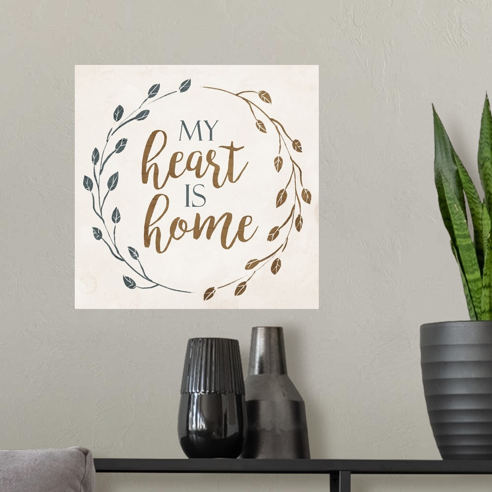 A modern room featuring "My Heart is Home" with a wreath of leaves on a cream background.