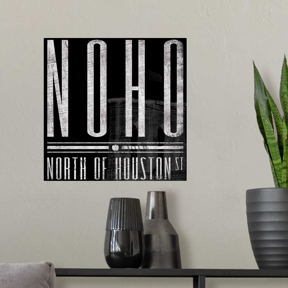 A modern room featuring Typographical artwork of New York City destination NOHO against a black background, with building.