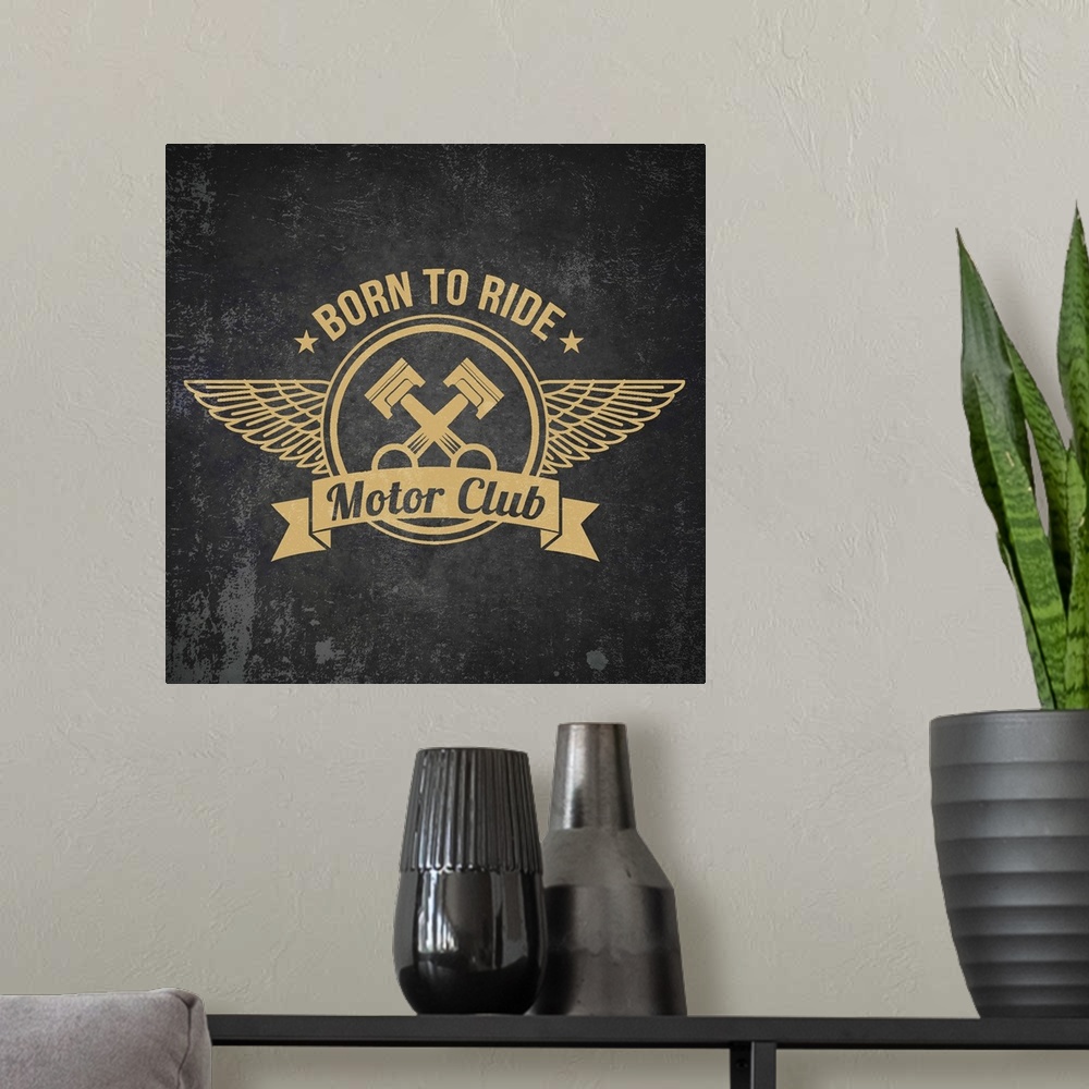 A modern room featuring Gold and black garage sign with a pistons and wings design.