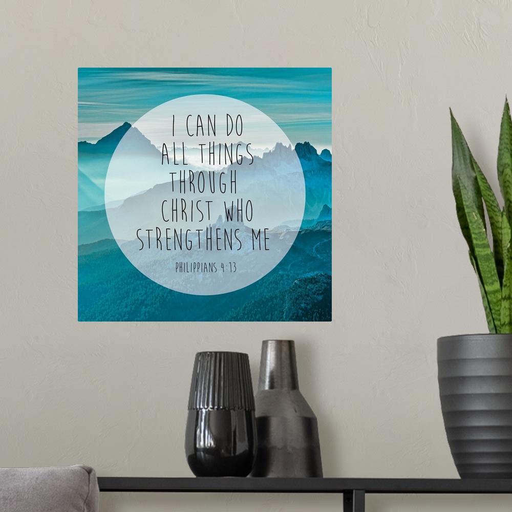 A modern room featuring Typography art of a Bible verse over an image of blue, misty mountains.
