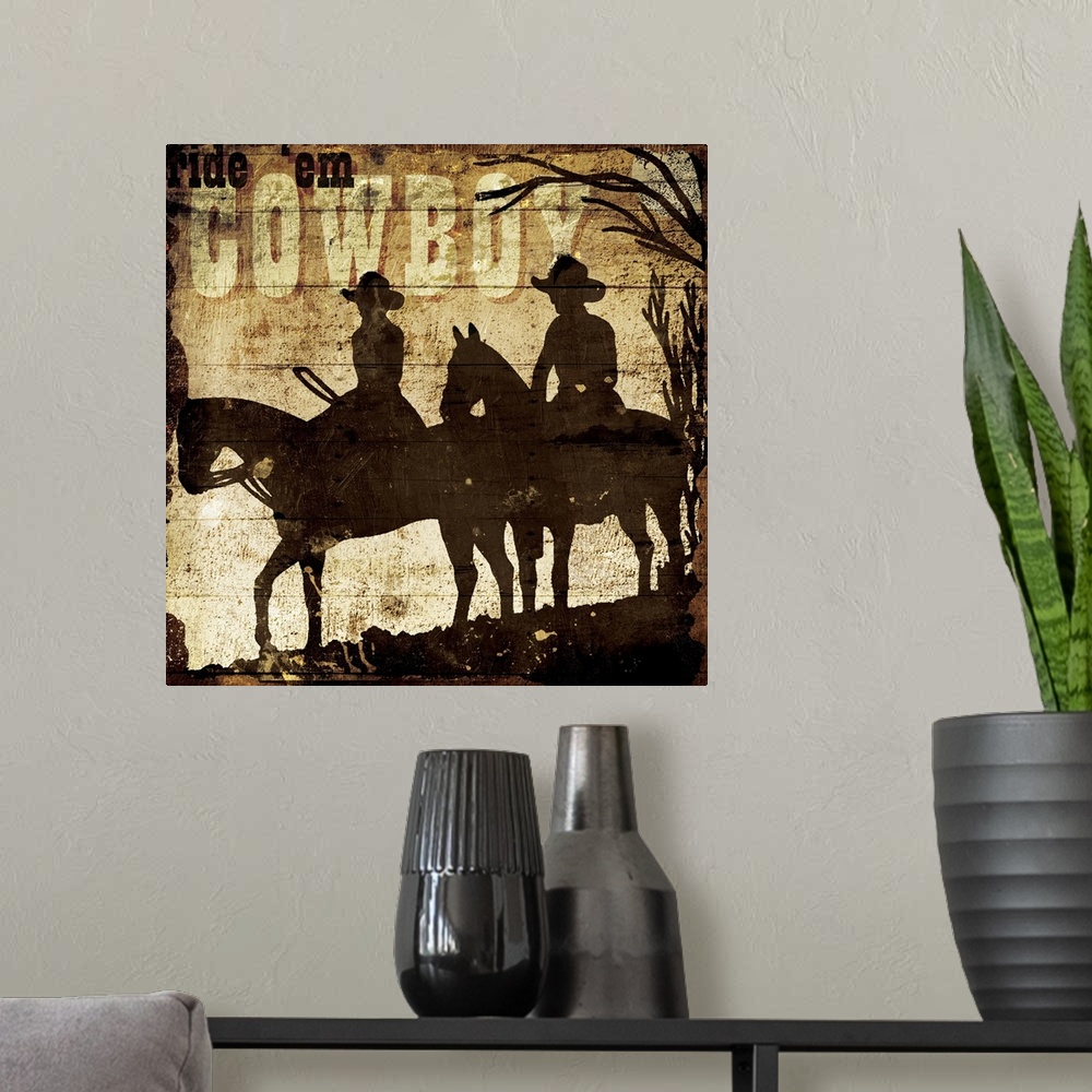 A modern room featuring A painting of a silhouette of two horses and cowboys in a desert scene with the phrase "Ride 'em ...