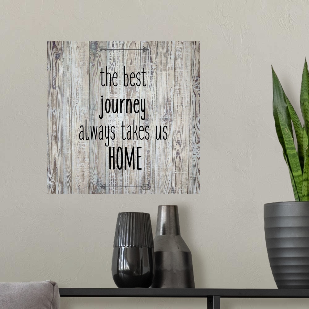 A modern room featuring The Best Journey Always Takes Us Home