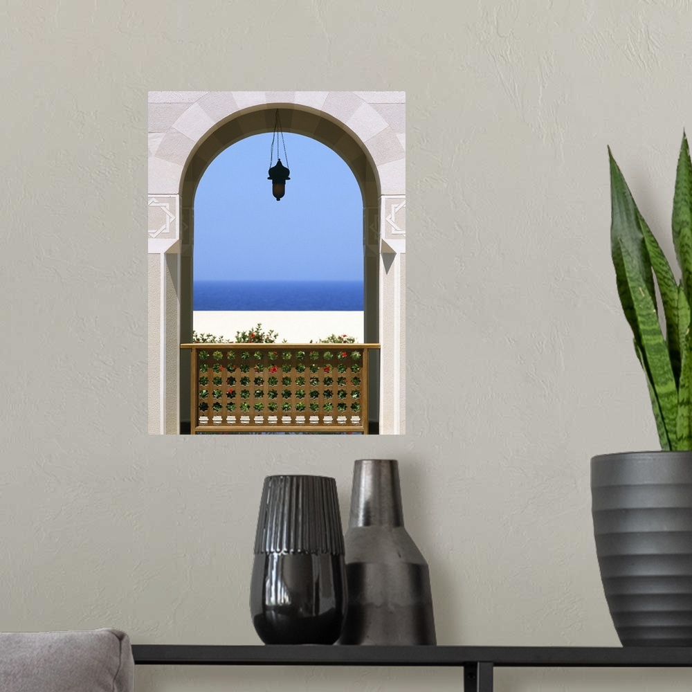 A modern room featuring View Through Archway To Beach And Sea