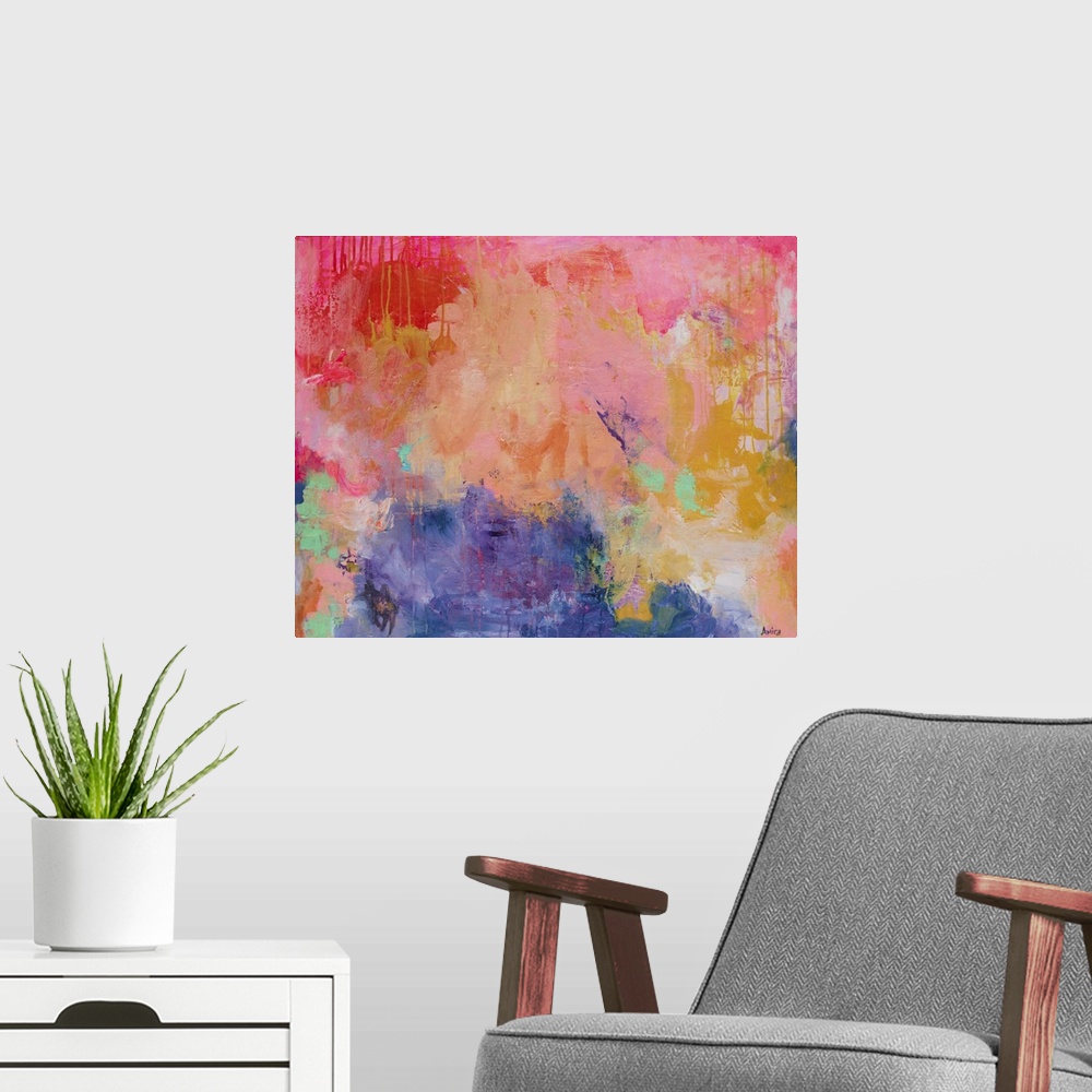 A modern room featuring Mixed media contemporary abstract artwork in vibrant shades of pink, orange, and yellow.