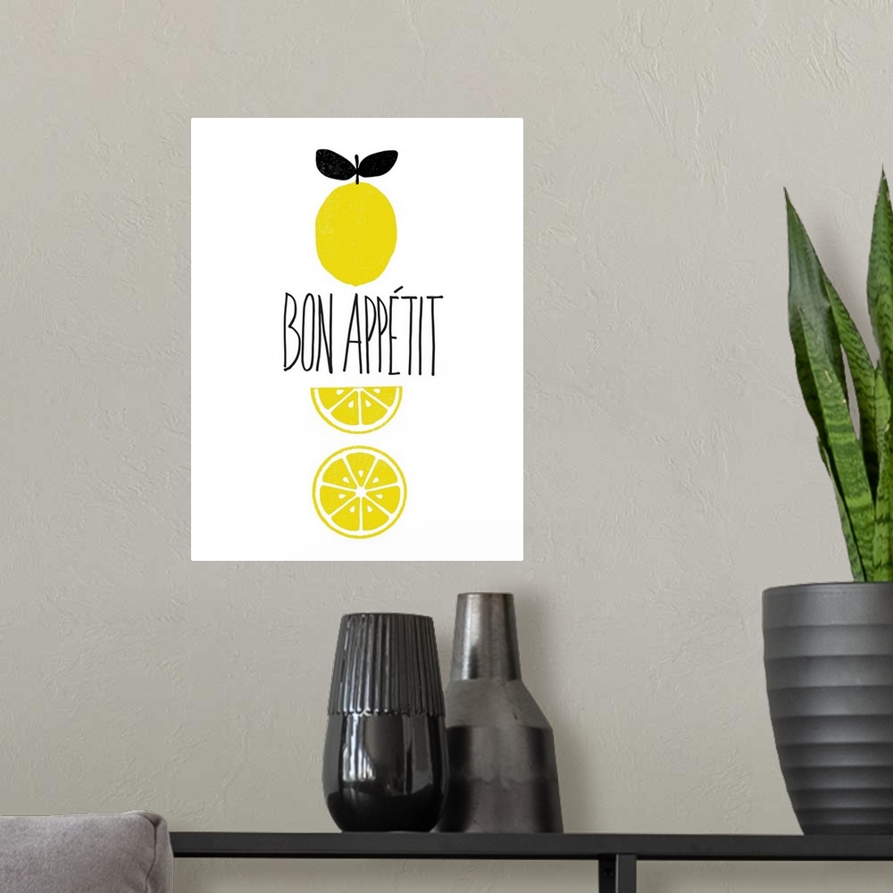 A modern room featuring "Bon Appetit" written in the center of a white background with illustrations of lemons.