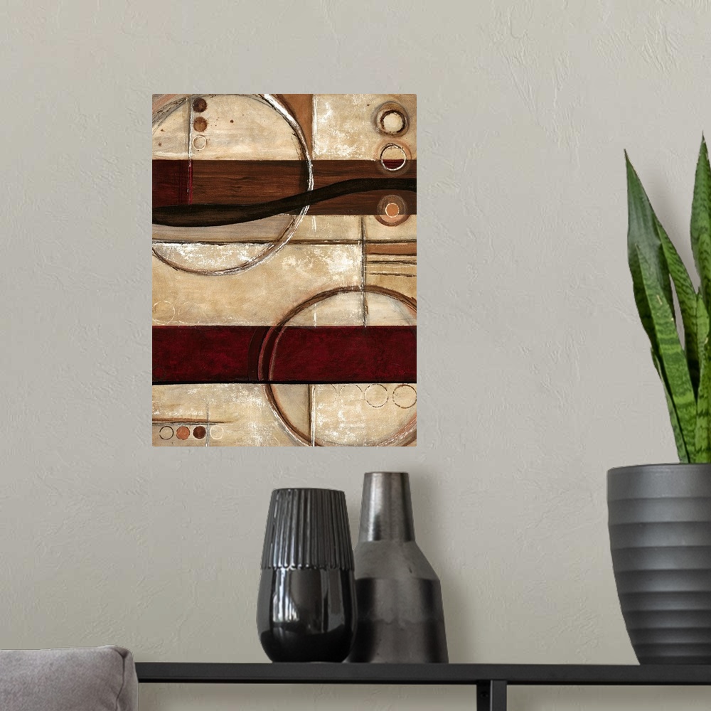 A modern room featuring Contemporary abstract home decor art work using warm earthy tones and rigid geometric shapes.