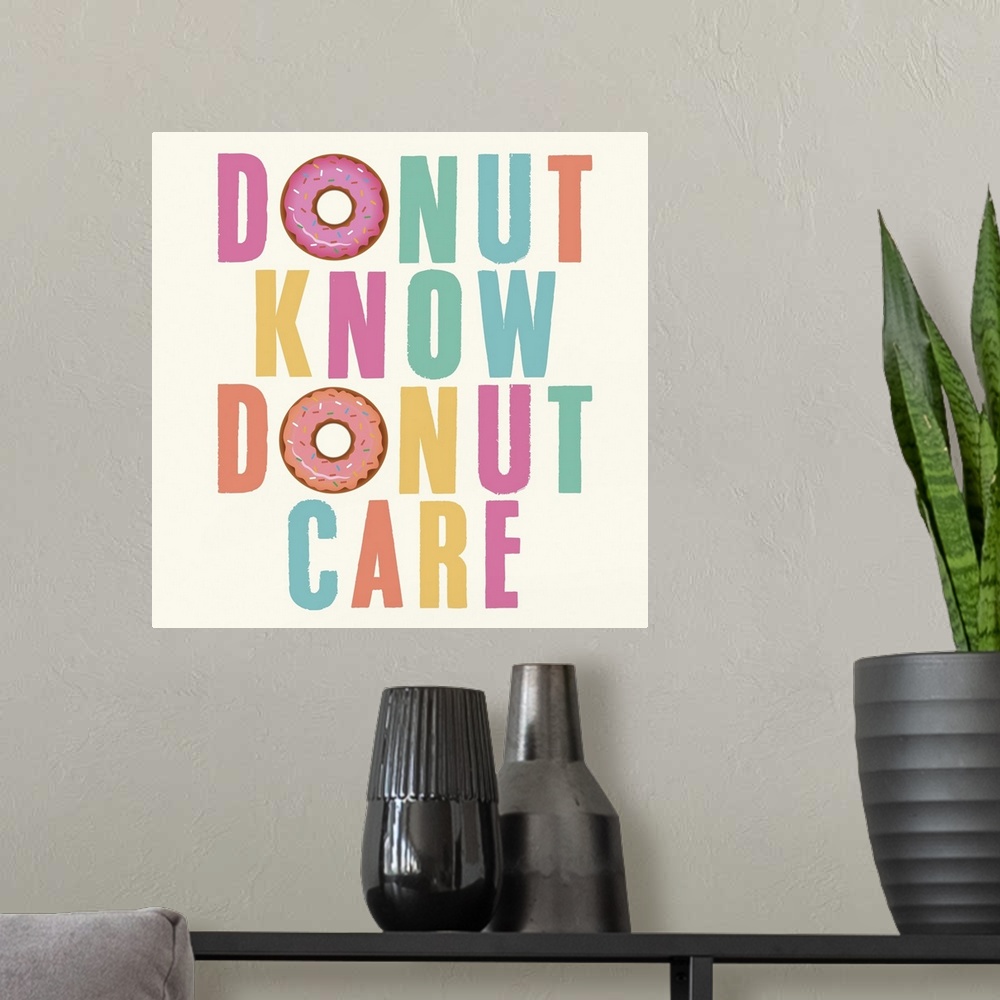 A modern room featuring Humorous typography artwork in pastel lettering with a donut motif.
