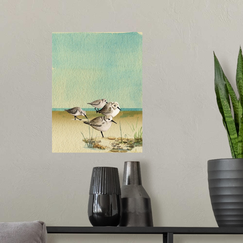 A modern room featuring Artwork of a group of sandpipers walking on a sandy beach.