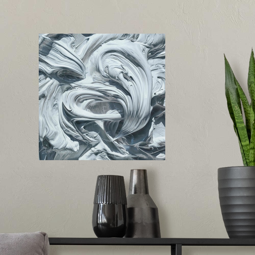 A modern room featuring Contemporary vivid realistic still-life painting of swirl and smeared white paint, resembling dri...