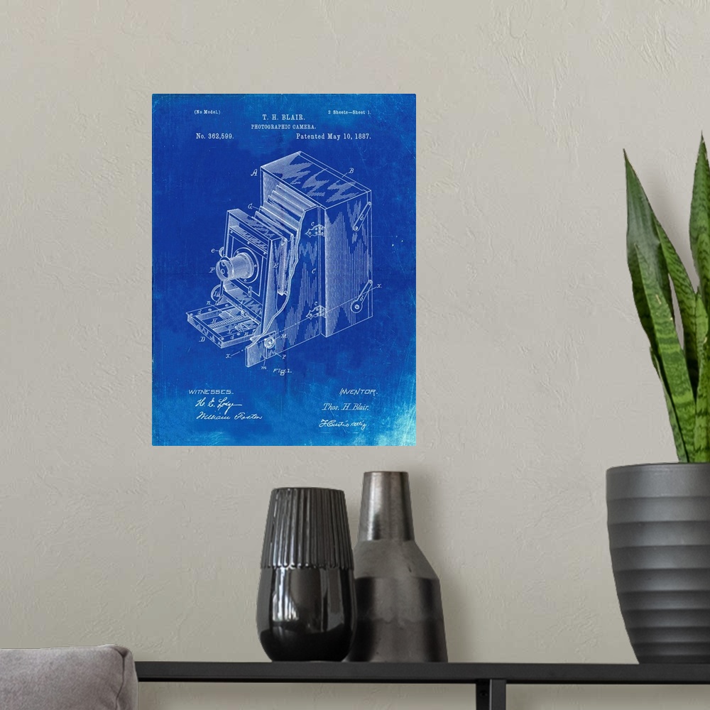 A modern room featuring Faded Blueprint Lucidograph Camera Patent Poster