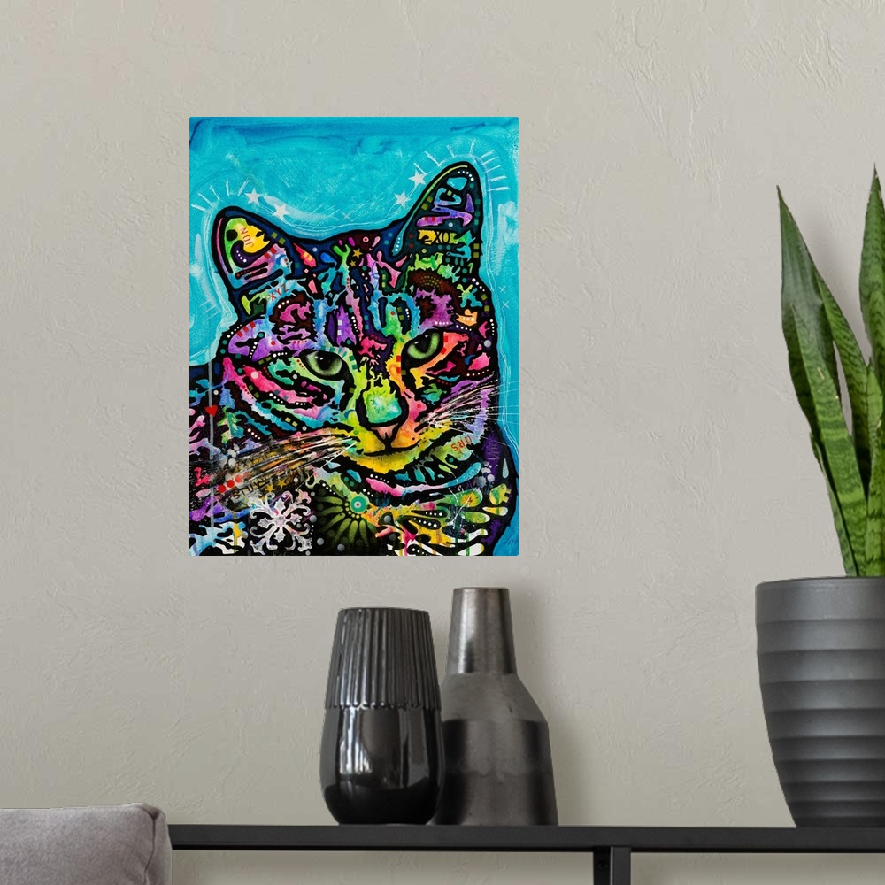 A modern room featuring Colorful painting of a cat named Kismet covered in abstract markings on a blue background.