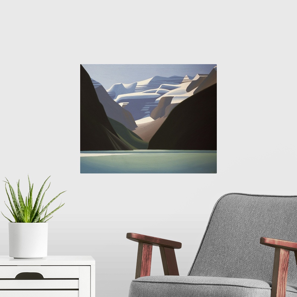 A modern room featuring Water in foreground with snow capped mountains rising up behind.