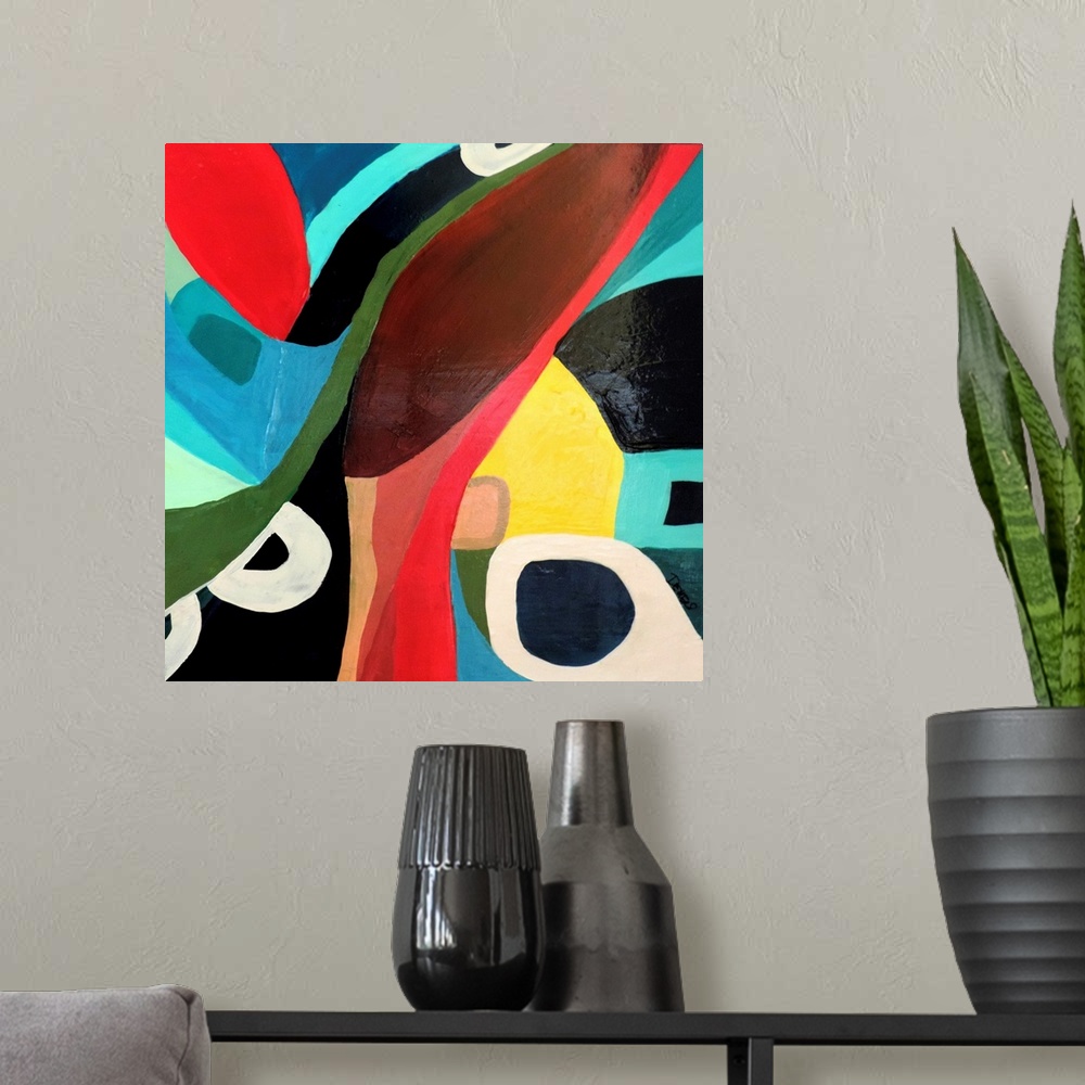 A modern room featuring Contemporary abstract painting using wild colors and shapes.