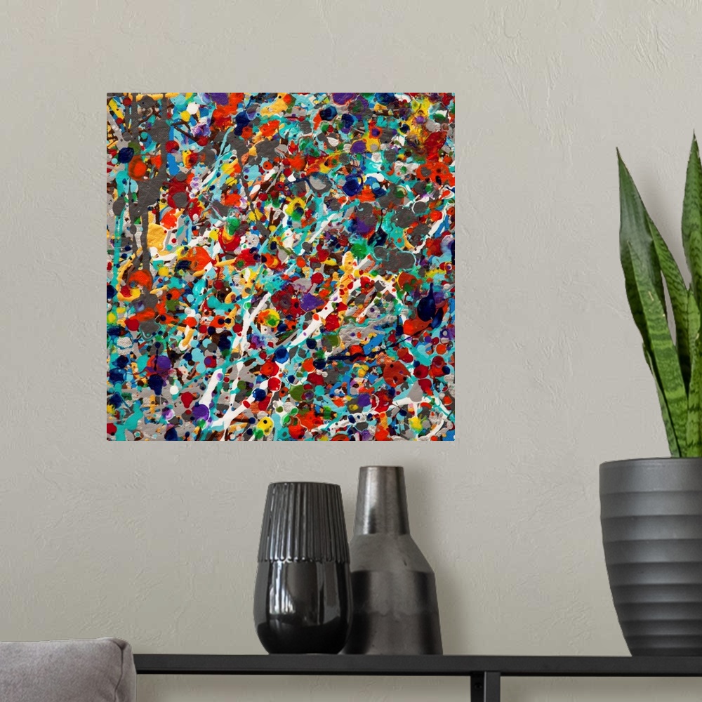 A modern room featuring Contemporary abstract painting made of multicolored paint splatters and swirls.