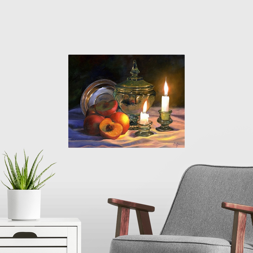 A modern room featuring Contemporary still life of peaches and lit candles.