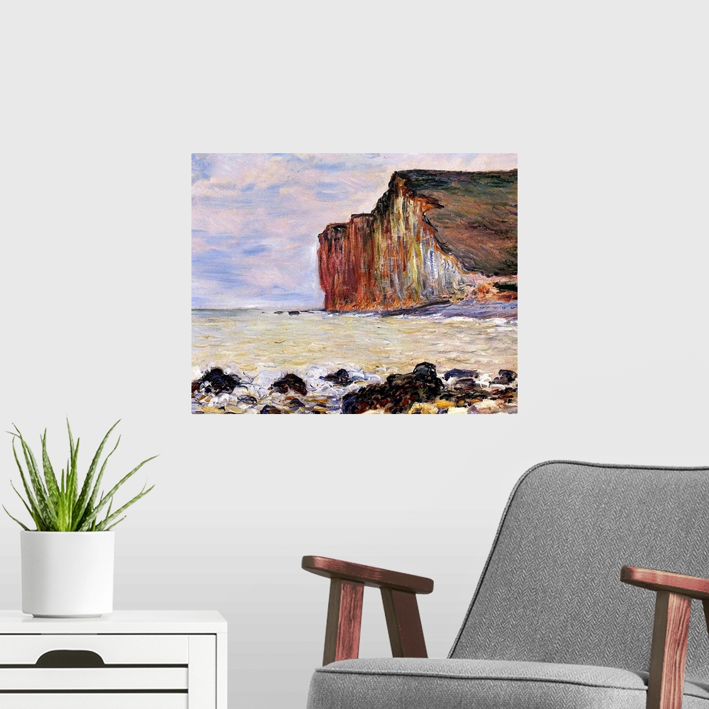 A modern room featuring Oil painting of rocky shoreline with cliff in the distance under a cloudy sky.
