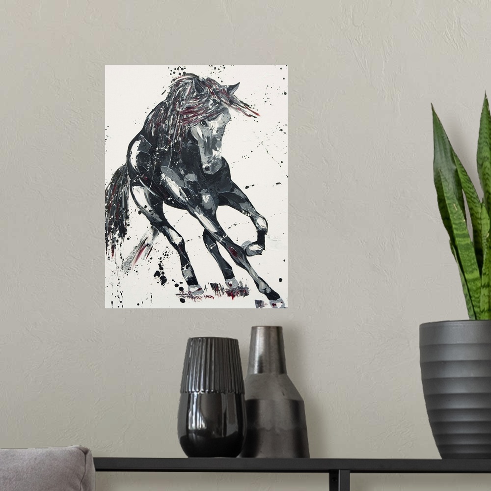 A modern room featuring Contemporary painting of a galloping horse in shades of black with red.