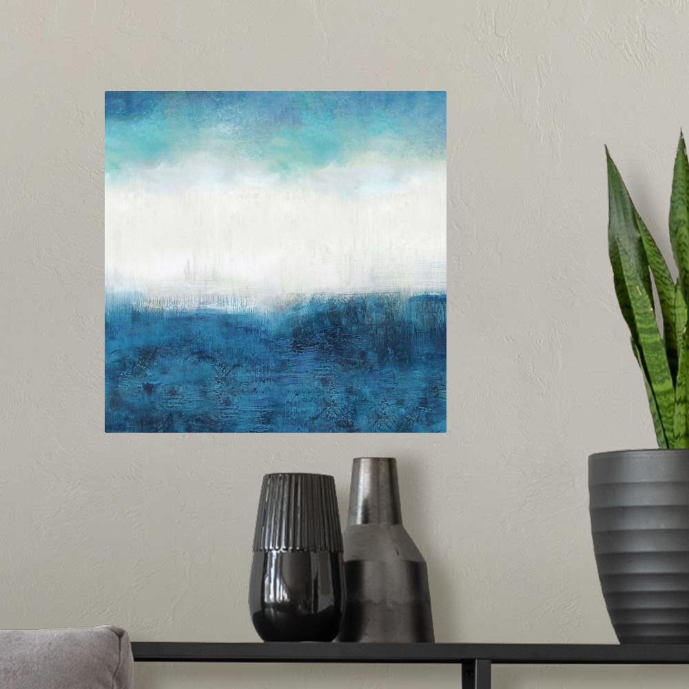 A modern room featuring Square abstract painting made with shades of blue and white.