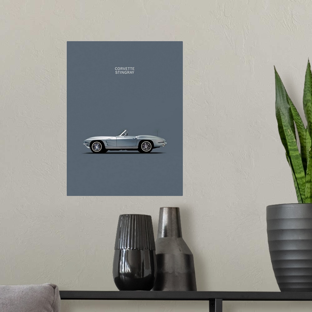 A modern room featuring Photograph of a grey Corvette 1965 printed on a grey background