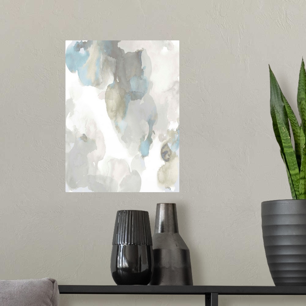 A modern room featuring Abstract painting with light blue and gray hues splattered together on a white background.