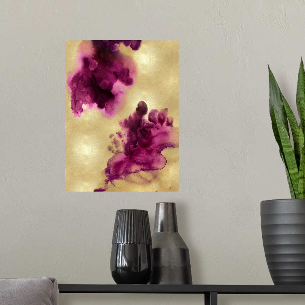 A modern room featuring Abstract painting with fuchsia hues splattered together on a gold background.