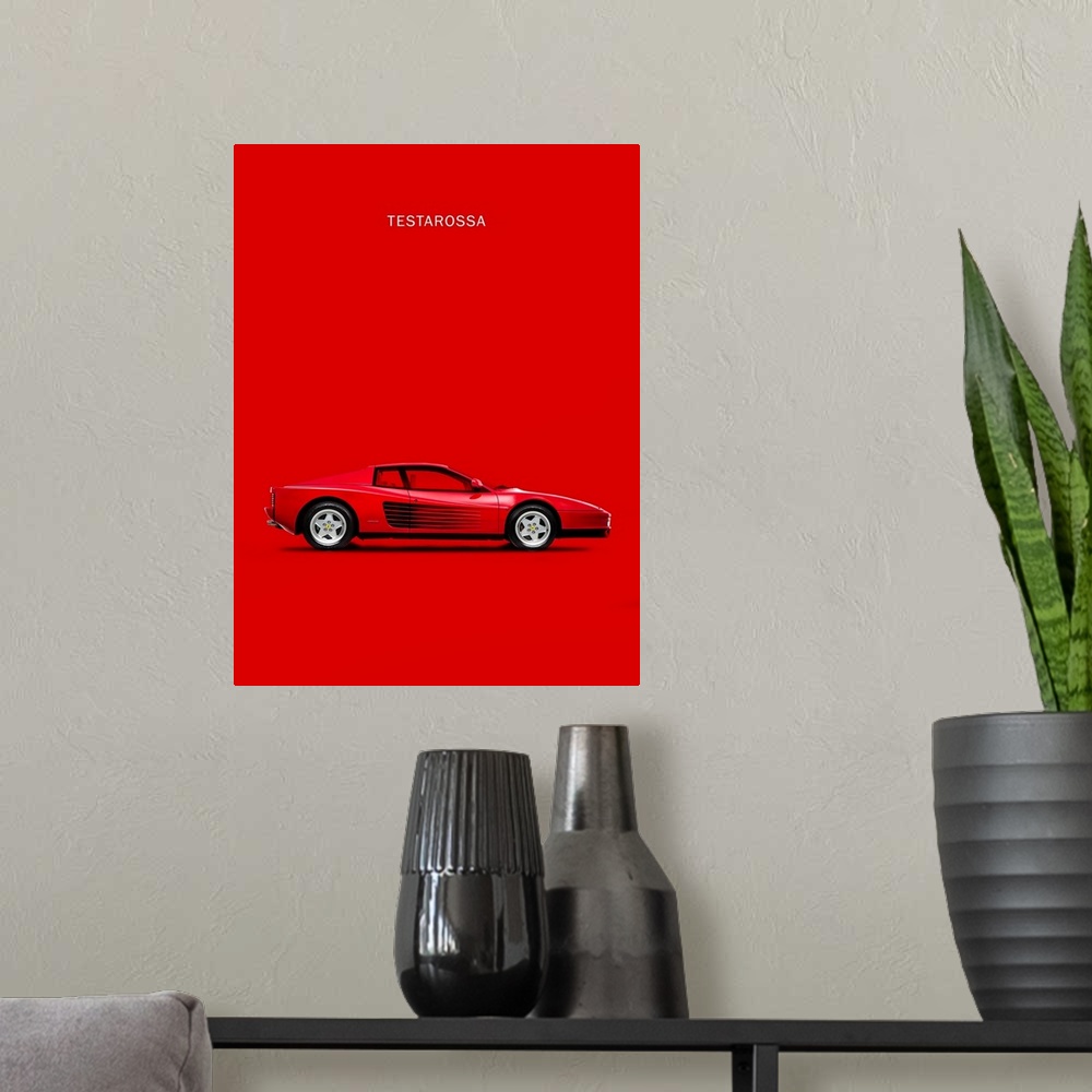 A modern room featuring Photograph of a bright red Ferrari Testarossa 84 printed on a red background
