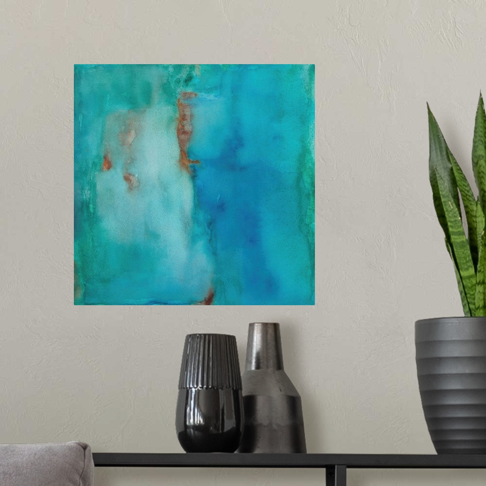 A modern room featuring Square abstract painting in shades of blue with hints of orange.