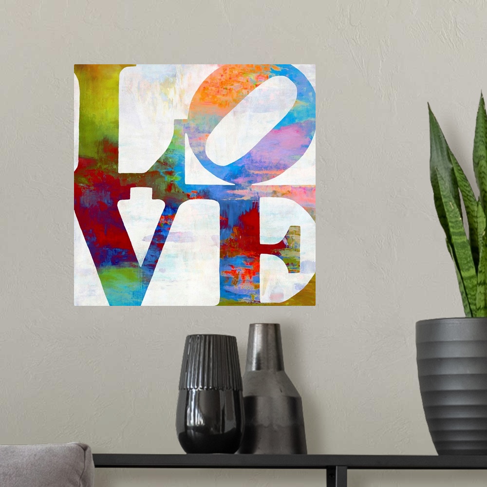 A modern room featuring "LOVE" written out in two lines in vibrant colors.