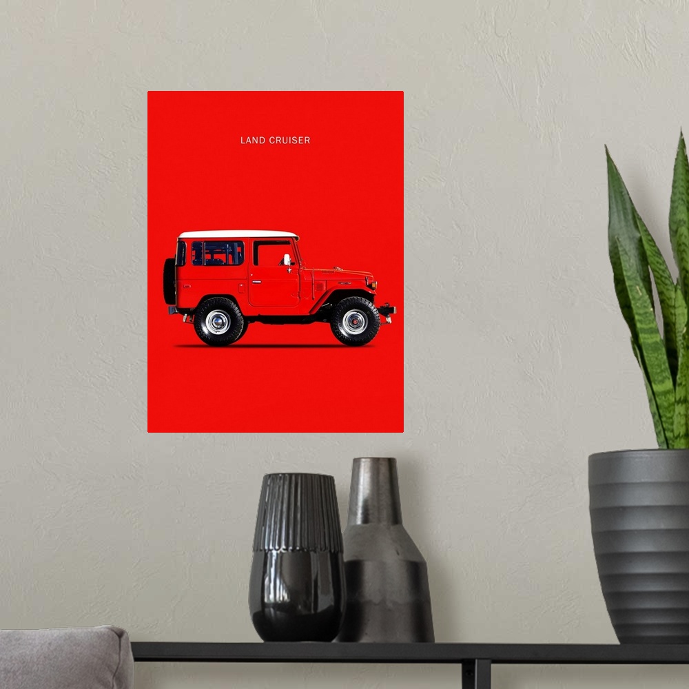 A modern room featuring Photograph of a red Toyota Land Cruiser FJ40 1977 with a white hood printed on a red background