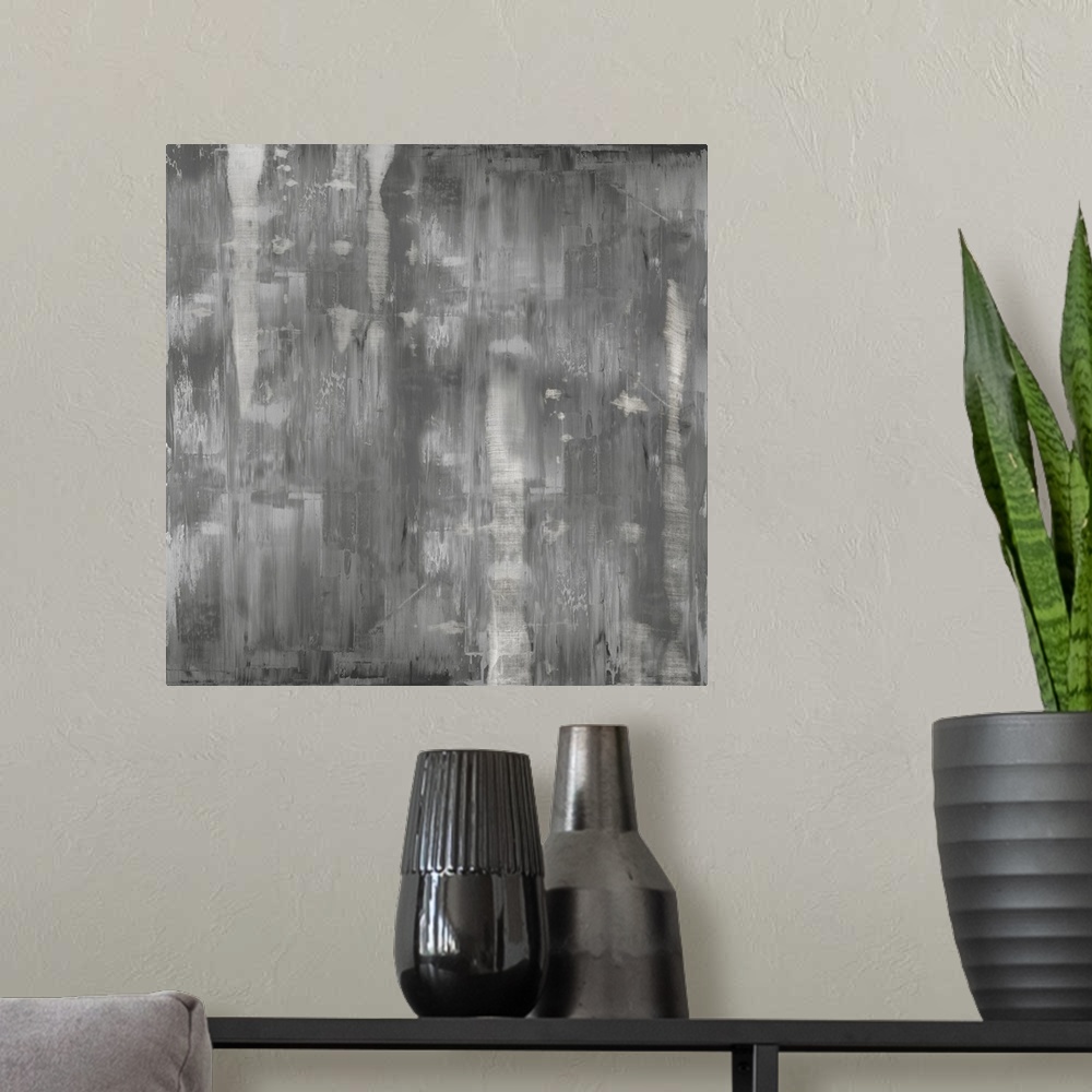 A modern room featuring Square abstract painting with shades of gray streaking down the canvas.