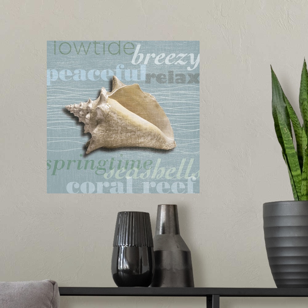 A modern room featuring Decorative artwork of a sea shell against a light blue background with beach theme words.
