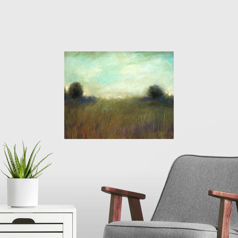 A modern room featuring A muted contemporary painting of tall grass in a field with a line of trees in the background.