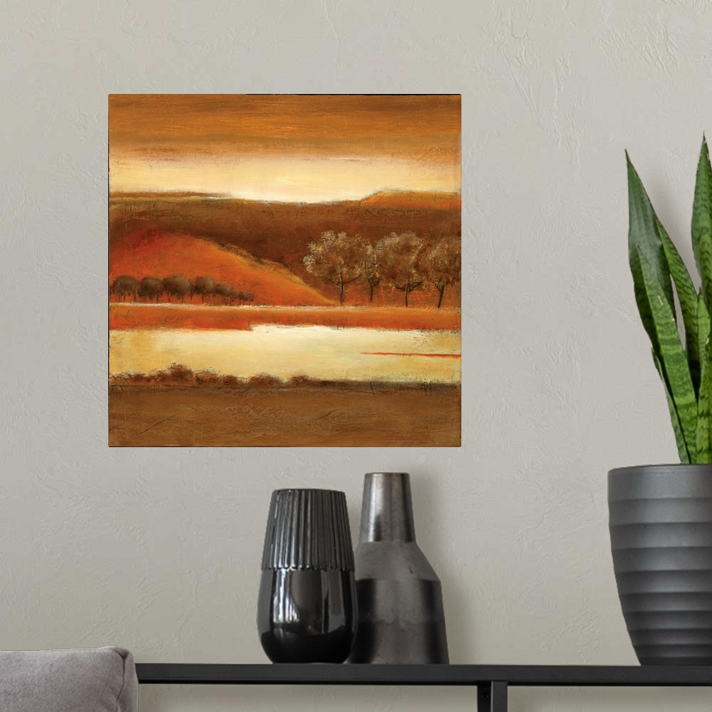 A modern room featuring A textured landscape of rolling hills with trees in tones of brown and orange.