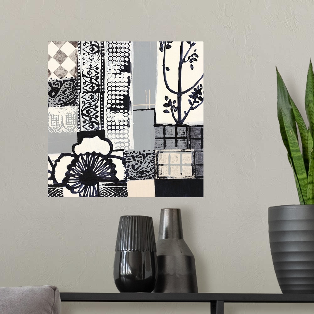 A modern room featuring Black and white painting of squared shapes of varies patterns and a large flower on the left.