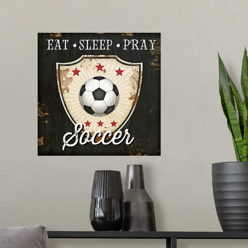 A modern room featuring Eat, Sleep, Pray, Soccer
