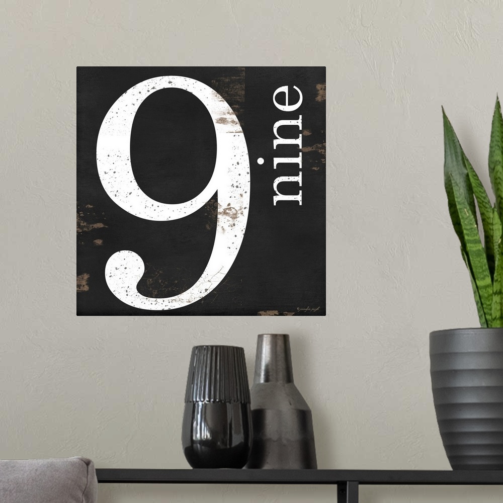 A modern room featuring Graphic art with the number nine bold and large in the center, and the word nine written smaller,...