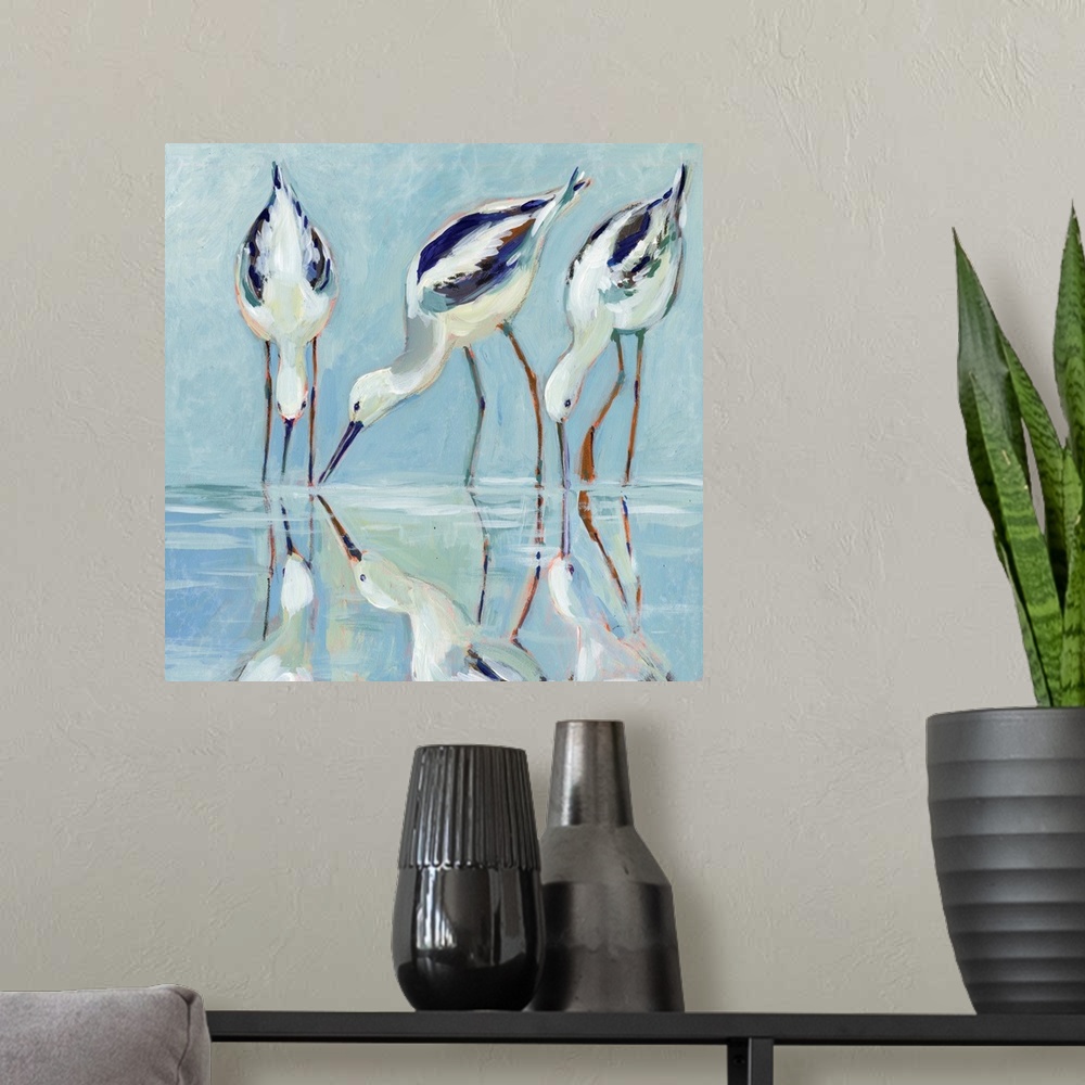 A modern room featuring A stately and elegant of stilt birds linger at water's edge.