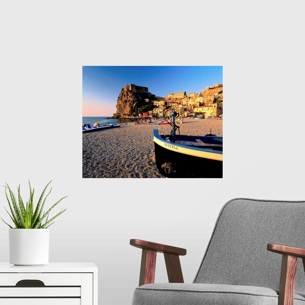 A modern room featuring Italy, Calabria, Scilla, view on town and beach