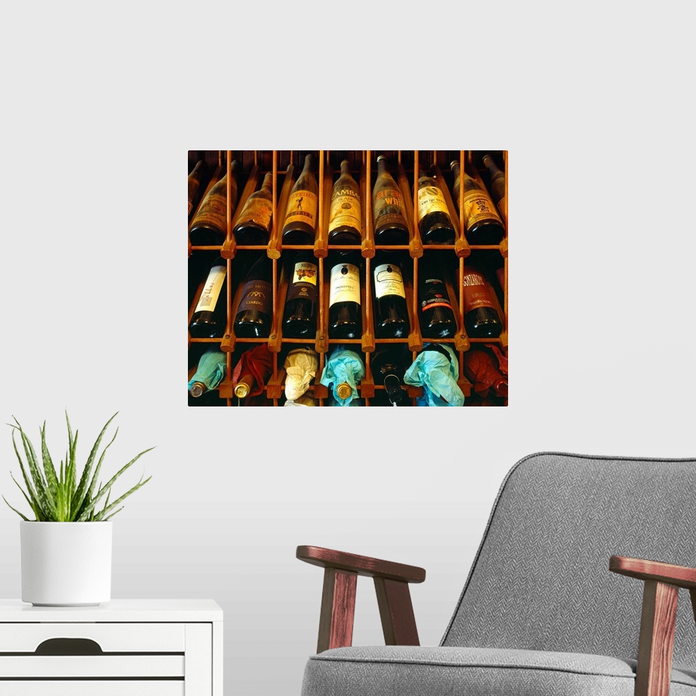 A modern room featuring Italy, Emilia Romagna, Ferrara, Enoteca 'Al Brindisi' wine bottles