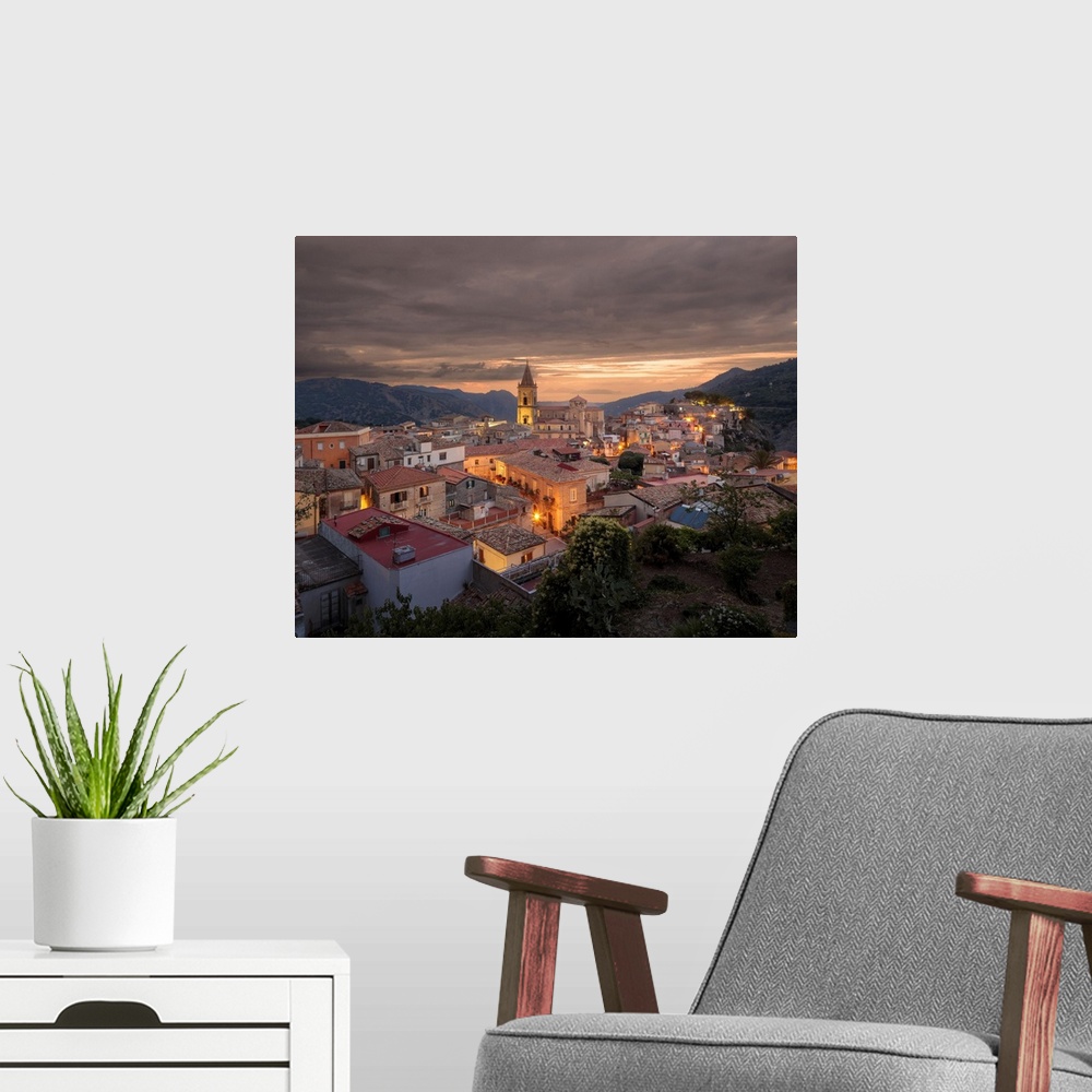 A modern room featuring Italy, Sicily, Messina district, Novara di Sicilia, Panoramic view of the town.