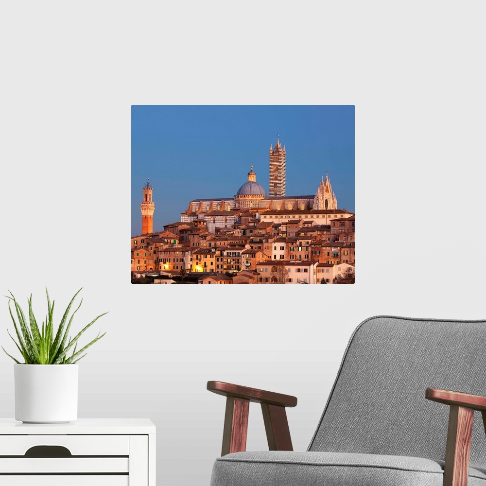 A modern room featuring Italy, Tuscany, Siena district, Siena, City at sunset with the cathedral in the background and To...