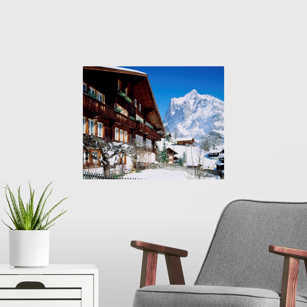 A modern room featuring Switzerland, Bern, typical chalet and view towards Wetterhorn mountain