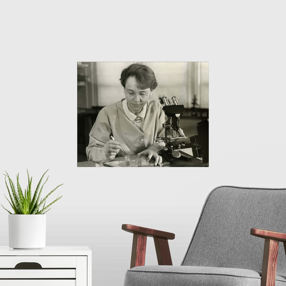 A modern room featuring Barbara McClintock, in her laboratory at Cold Spring Harbor, New York, in 1947. The geneticist wo...