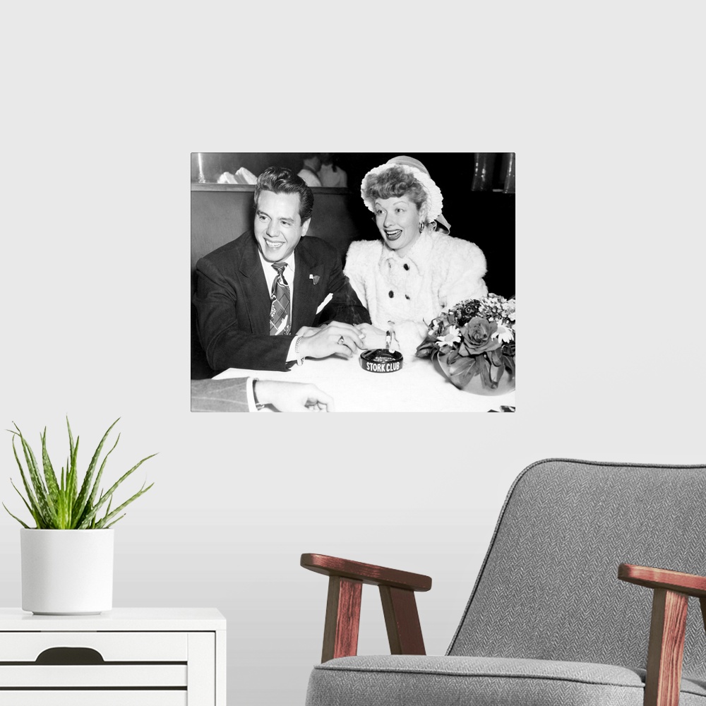 A modern room featuring Black and white photograph of Desi Arnaz and Lucille Ball.