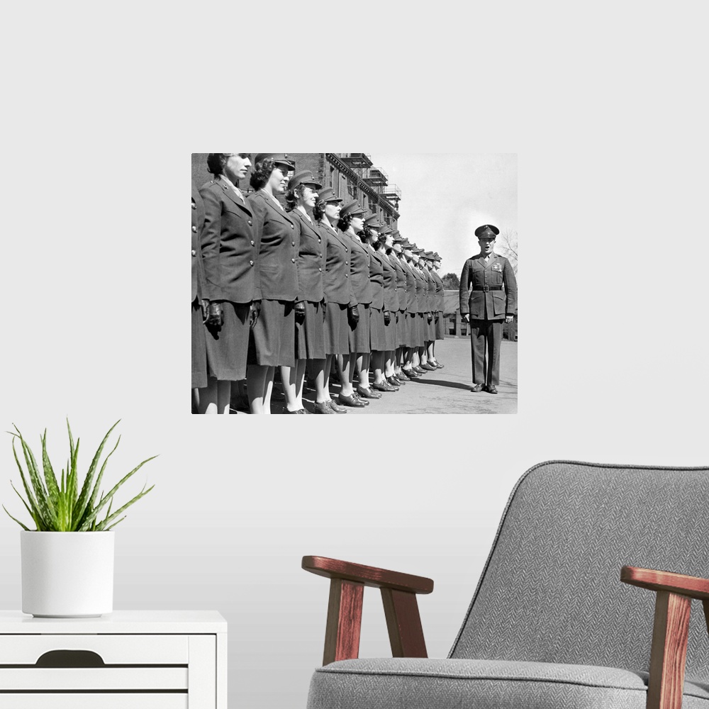 A modern room featuring Drill Instructor with uniformed recruits at Marine Corps Women's Reserve Officer's Candidate Scho...