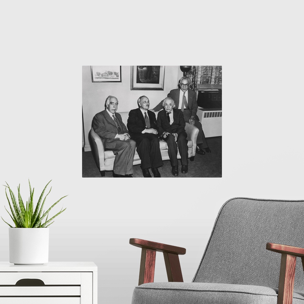 A modern room featuring Portrait of four famous nuclear physicists. L-R: Niels Bohr; James Franck; Albert Einstein; and I...